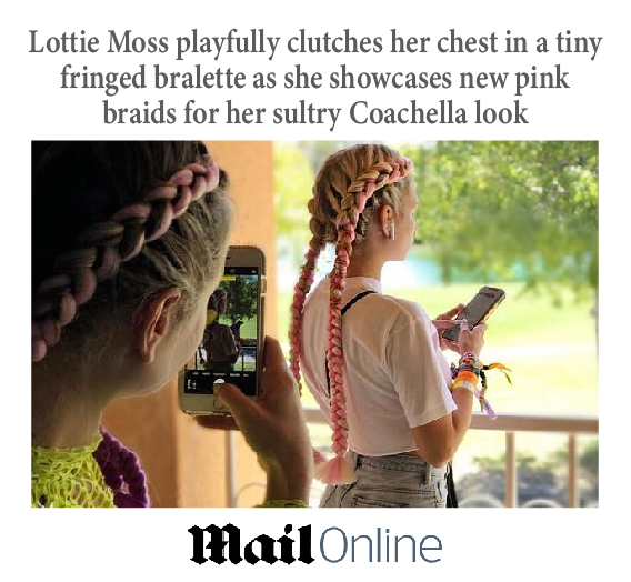Mail Online with an image of Lottie Moss taking pictures in a park. She has long pink braids on both sides of her head.